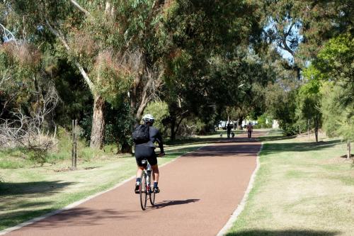 Picturesque family friendly park close right on the river with cycle and walking path access.